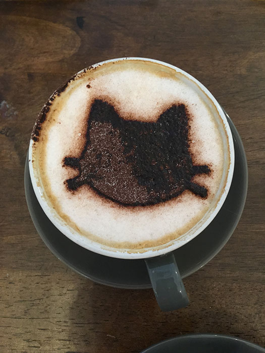 Capuccino with a cat stencil on it